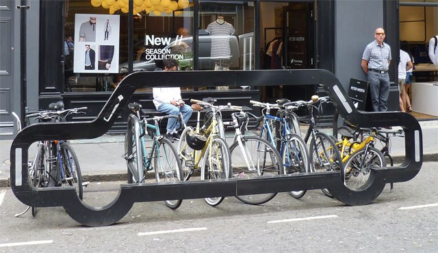 https://en.wikipedia.org/wiki/Bicycle_parking#/media/File:Car_shaped_bicycle_rack_in_Earlham_Street_-_cropped.jpg